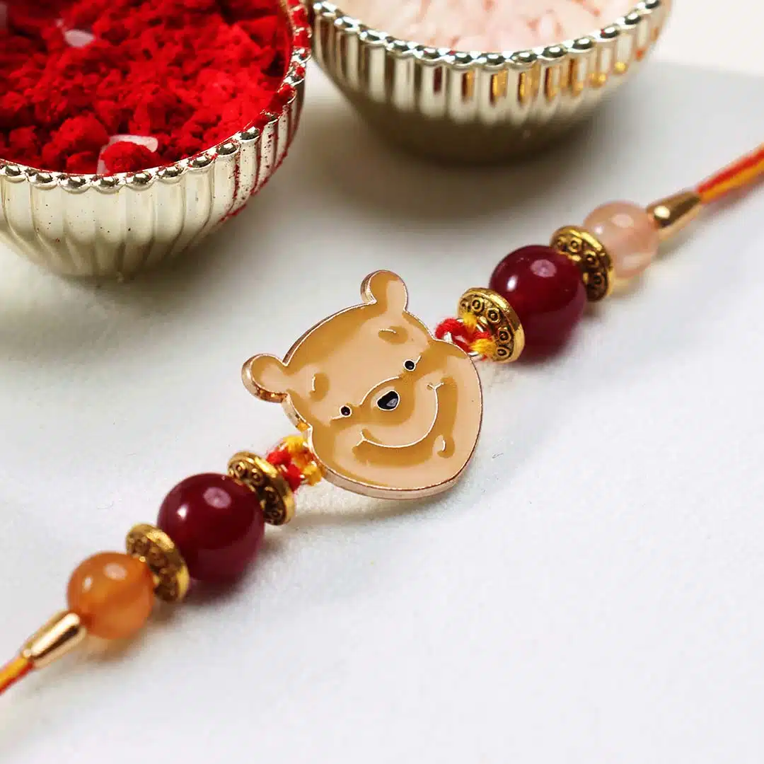 Shubhanjali-Winnie The Pooh Motivation Crystal Rakhi (2) Shop Winnie The Pooh Motivation Rakhi For motivate,confidence, creativity