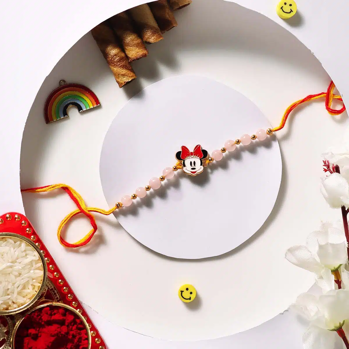 Shubhanjali-Rose Quartz Beads Minnie Mouse Charm Kids Rakhi (3) Shop Rose Quartz Beads Minnie Mouse Charm Kids Rakhi