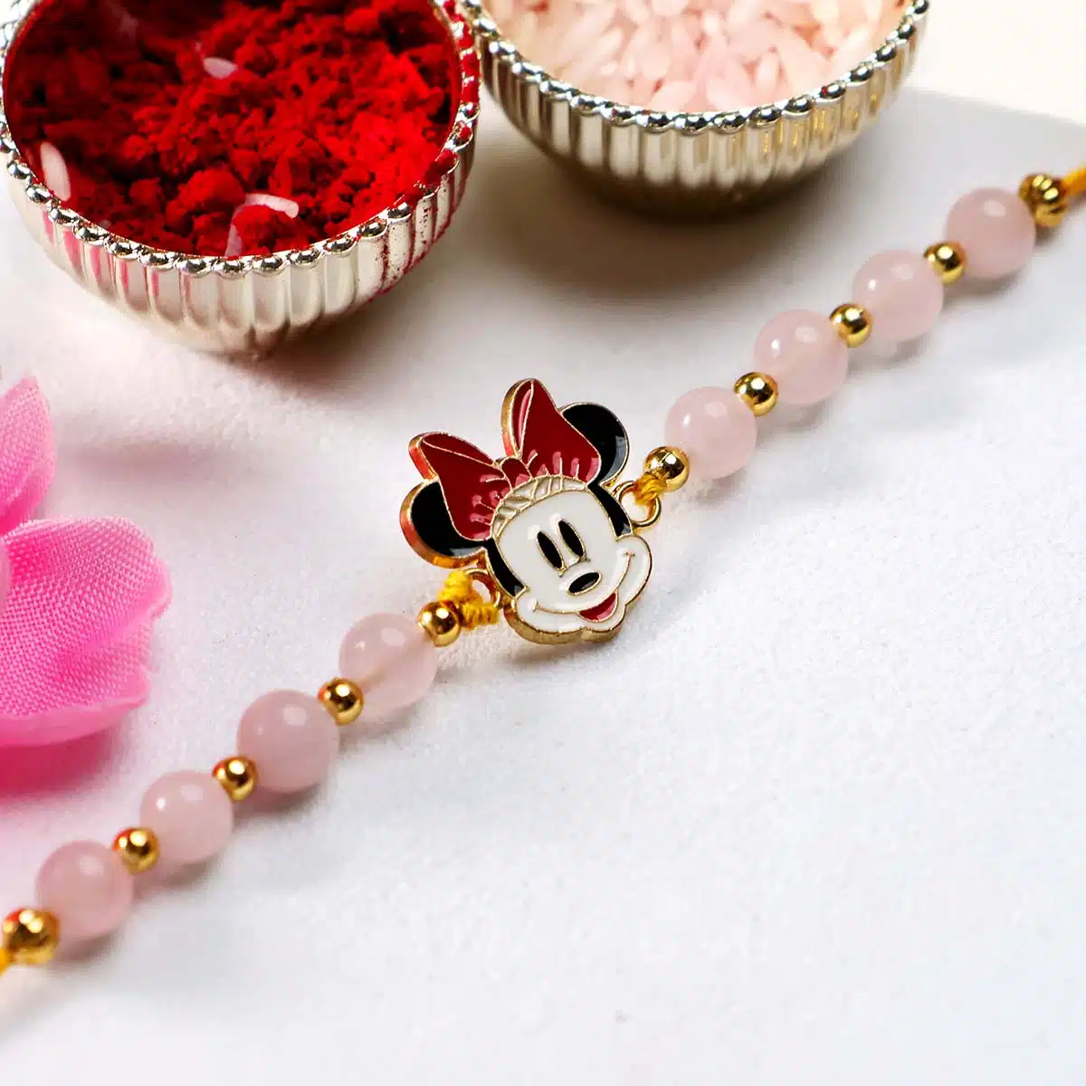 Shubhanjali-Rose Quartz Beads Minnie Mouse Charm Kids Rakhi (4) Shop Rose Quartz Beads Minnie Mouse Charm Kids Rakhi