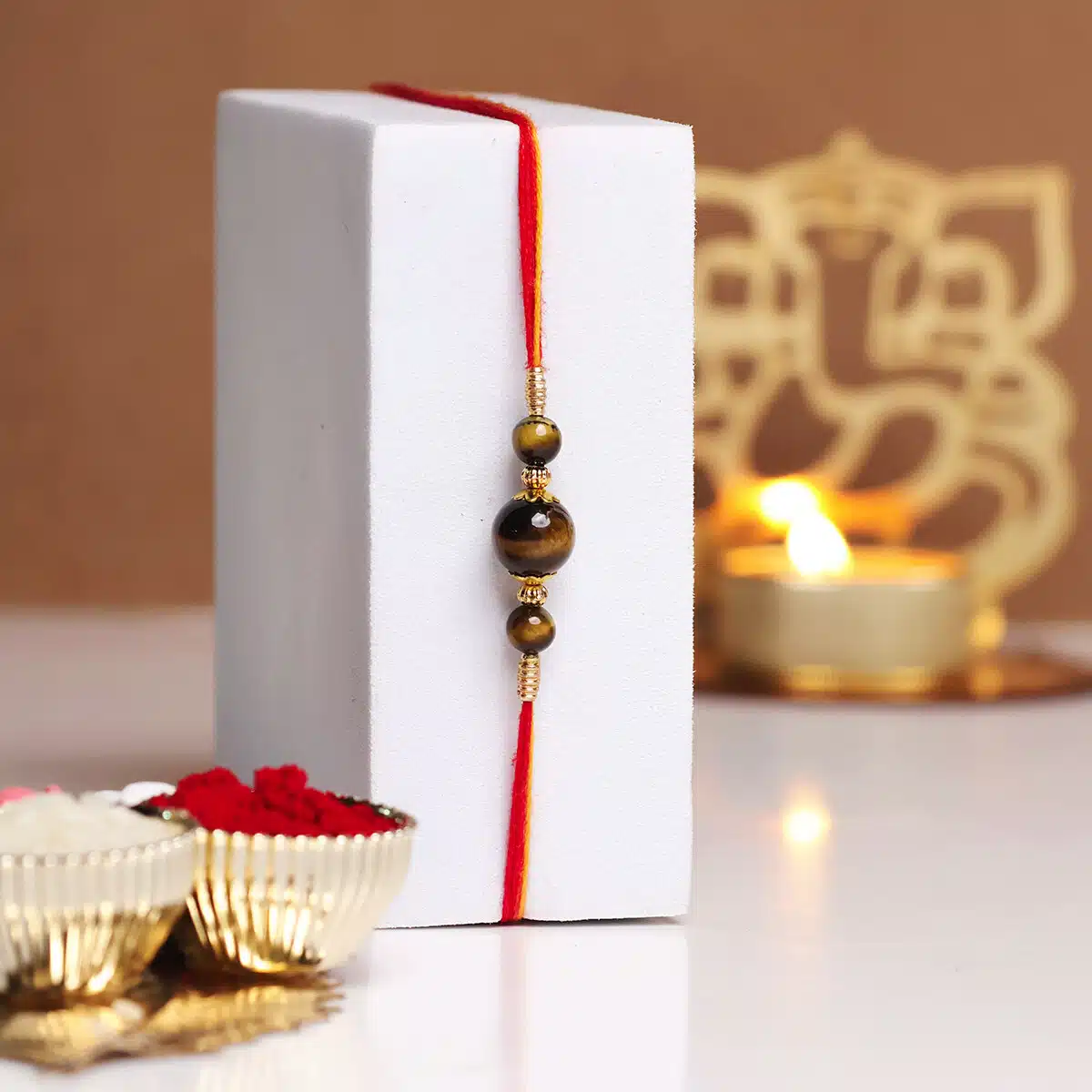 Shubhanjali-Tiger Eye 3 Beads Crystal Rakhi (4) Shop Natural Tiger Eye Crystal 3 Beads Rakhi