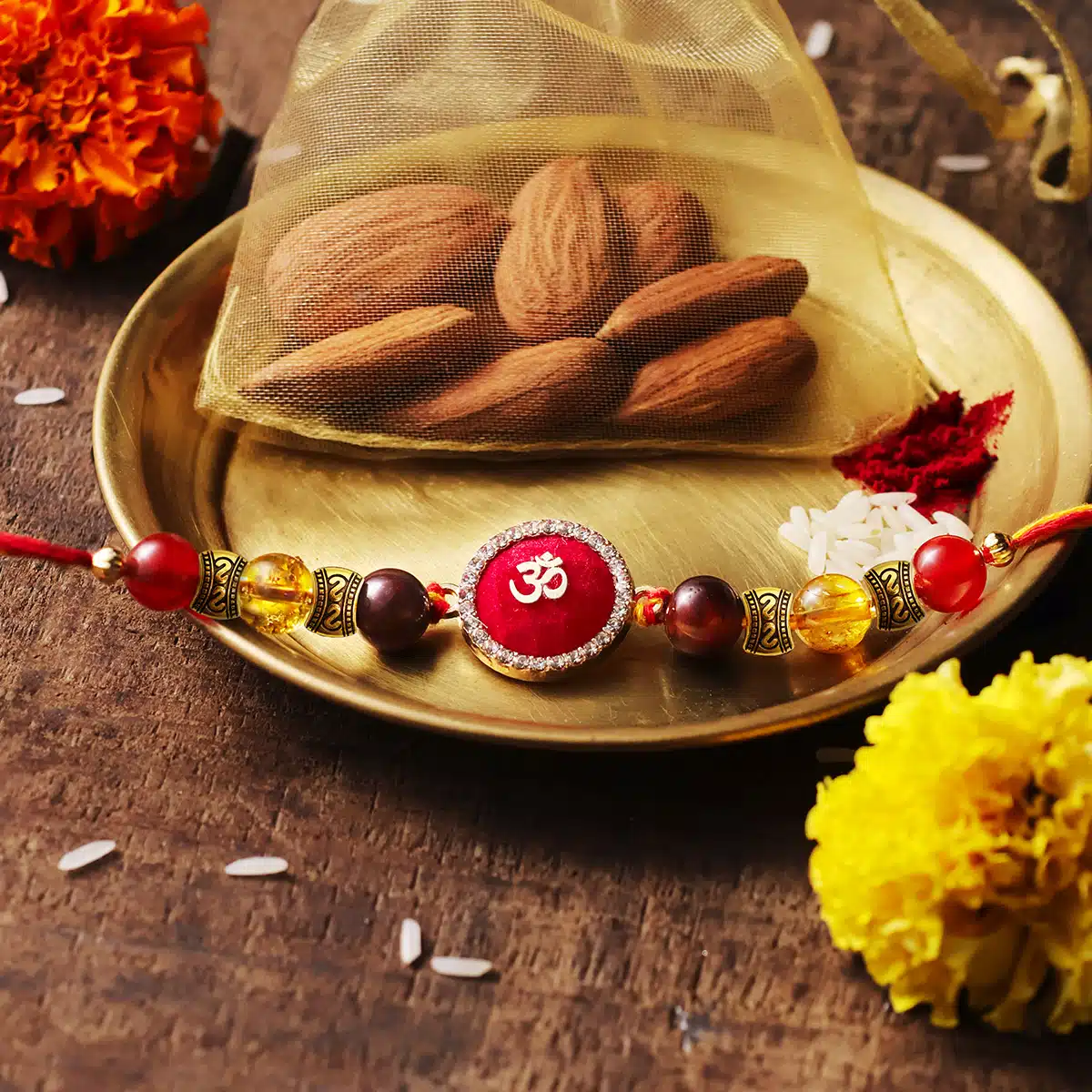 Motivation Rakhi With Red Om Charm Shop Motivation Rakhi With Red Om Charm