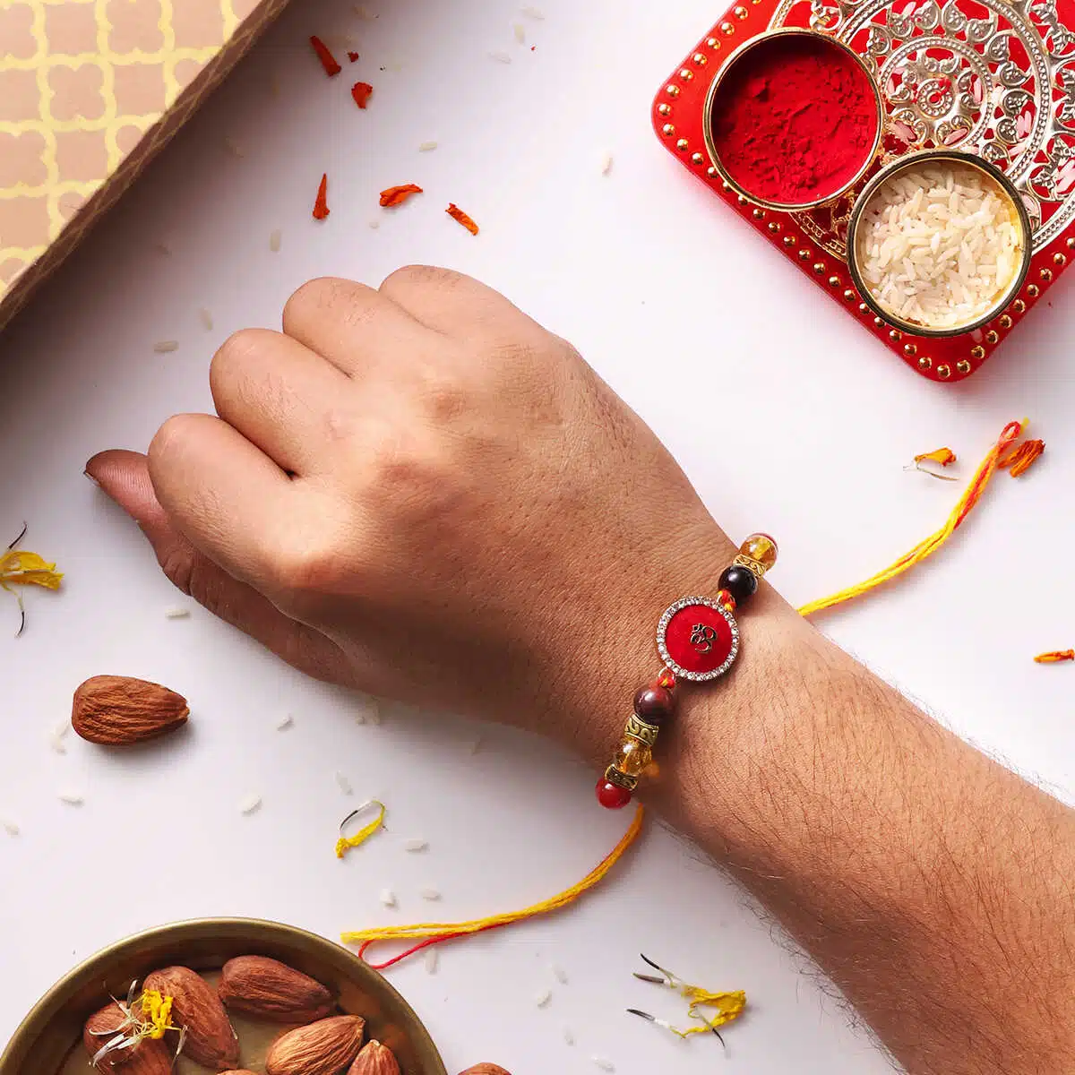 Shubhanjali-Motivation Rakhi With Red Om Charm (4) Shop Motivation Rakhi With Red Om Charm