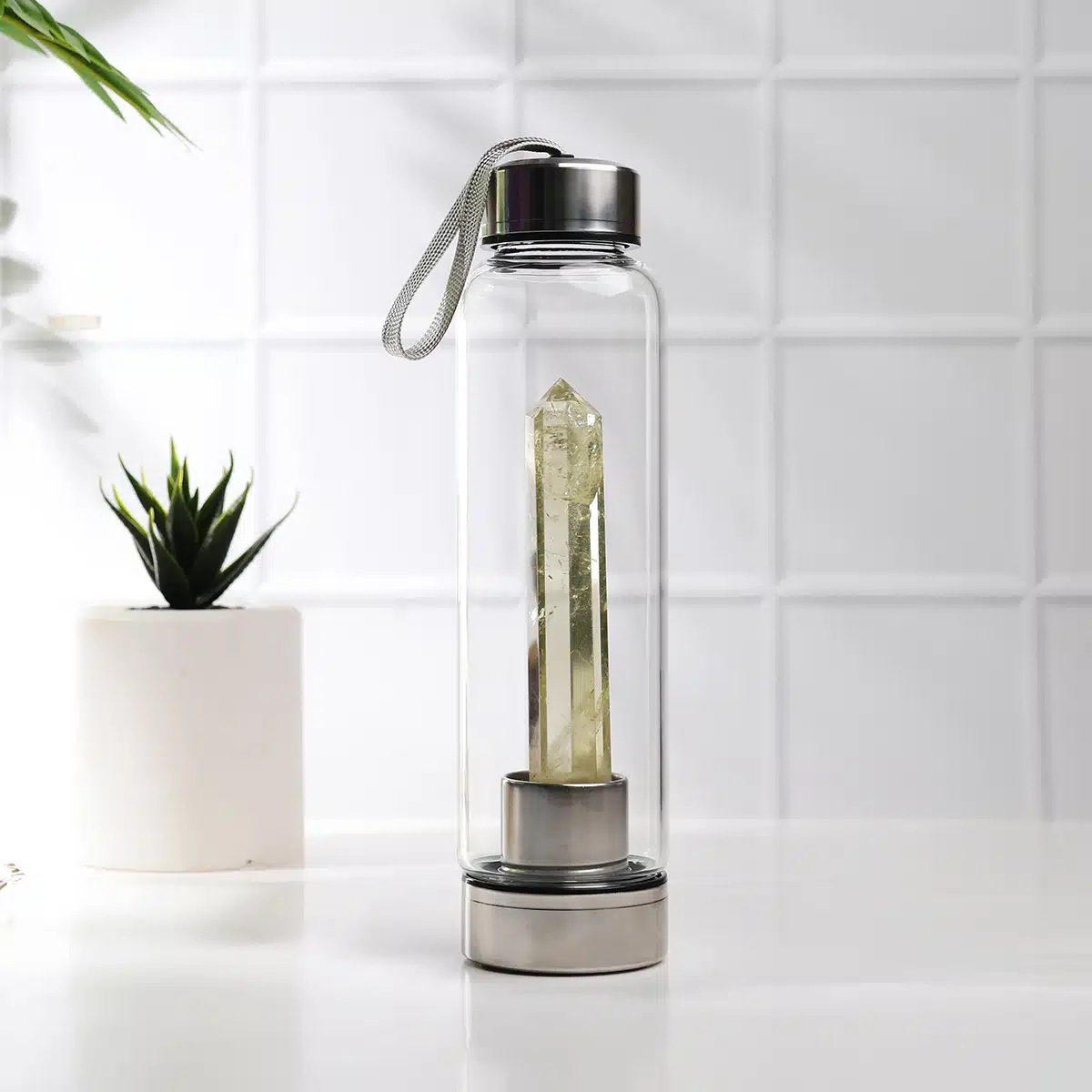 Glass water bottle with citrin pencil