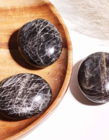 black moonstone palm stone
