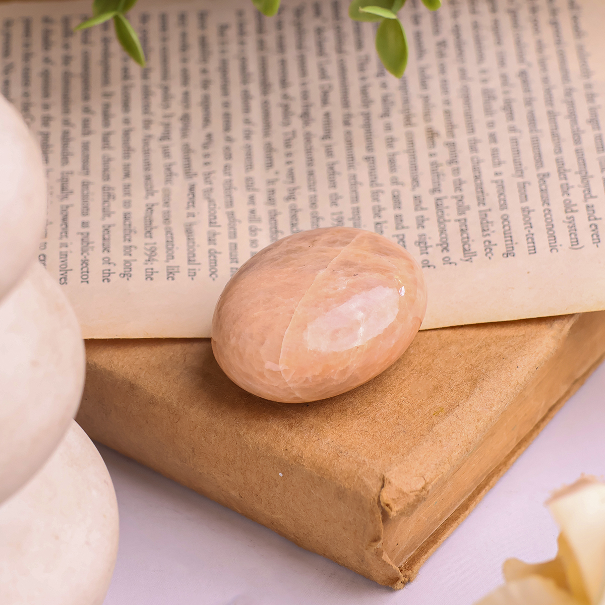 Peach Moonstone Palm Stone (2) peach moonstone palm stone 50 100 gms